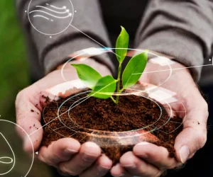 Smart agriculture IoT with hand planting tree background